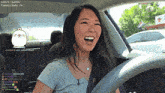 a woman in a car with sleeper3 just subscribed written on the screen