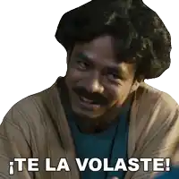 a man with a beard is smiling with the words te la volaste below him
