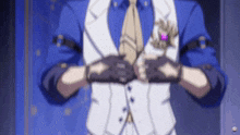 a man in a blue suit and tie is adjusting his tie .