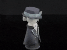 a cartoon character wearing a hat and a suit is standing in the dark .