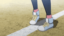 a person wearing a pair of blue and white shoes