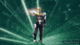 a silhouette of a person standing in front of a green light .