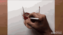 a person is drawing a woman wearing a mask on a piece of paper ..