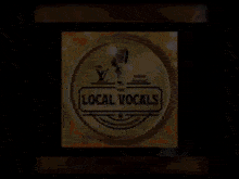 a logo for the local vocals shows a microphone on a yellow background