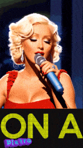 a woman singing into a microphone with the word disco in the bottom right corner