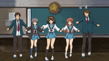 a group of anime characters are dancing in front of a chalkboard that says " my height "