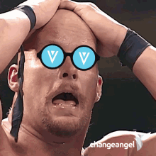 a man wearing a pair of glasses with the letter v on it