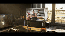 a bottle of budweiser sits in front of a television