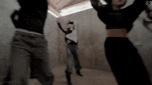 a group of people are jumping in the air with the letter s on the bottom left