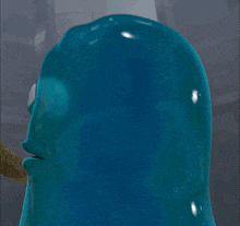 a close up of a blue cartoon character with a big eye