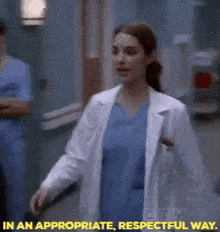 a woman in a lab coat is walking down a hallway with the words in an appropriate respectful way above her