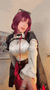 a woman in a cosplay costume is standing in front of a shelf with figurines on it .