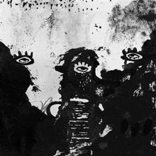 it is a black and white painting with a lot of spots and eyes on it .