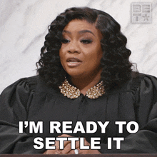 a woman in a court gown says i 'm ready to settle it