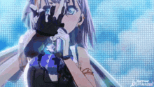 a girl is holding a microphone in front of her face and covering her face with her hands .