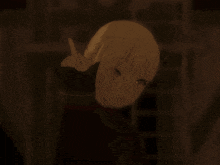 a girl with a bow in her hair is smoking a cigarette in a dark room