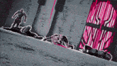 a group of people are laying on the ground in front of a sign that says ainblossom