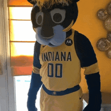 a mascot wearing a yellow indiana jersey with the number 00 on it