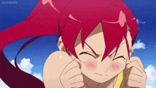 a girl with red hair is making a face in front of a blue sky