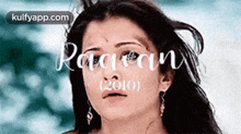 a close up of a woman 's face with the words raojan written on it .