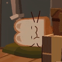 a slice of bread with a face on it is sitting on a wooden floor .