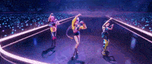 three women are dancing on a stage in front of a crowd of people .
