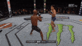 two men are fighting in a boxing ring with a monster on the floor