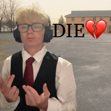 a man wearing headphones stands in front of a broken heart and the word die