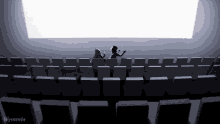 a drawing of two people in an auditorium with wyverein written on the bottom