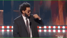 iheartradio music awards the weeknd fixing glasses yeah