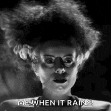 a black and white photo of a woman with a wig saying `` me when it rains '' .