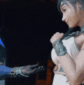 a woman in a white dress holds a man 's hand in a video game