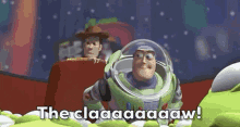 buzz lightyear from toy story is sitting in a pile of green aliens and says the claaaaaw !