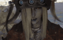 a cartoon character wearing a helmet with three circles on it .