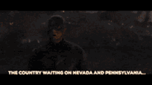 a man is kneeling down in a field with the words georgia on your left below him
