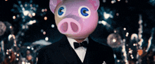 a man in a tuxedo with a pink pig head