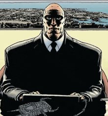 a man in a suit and tie is sitting in front of a city holding a tablet .