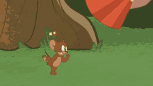 jerry from tom and jerry is standing next to a hand