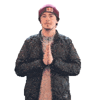 a man wearing a red bull beanie and a black jacket