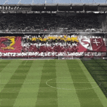 a soccer field with a banner that says metz-mon-amour