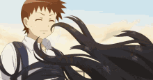 a boy and a girl are standing next to each other and the girl 's hair is blowing in the wind