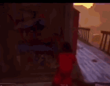 a man in a mask is standing next to a woman in a red shirt .