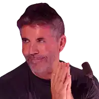 a man with a beard is smiling and clapping his hands