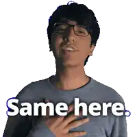 a man wearing glasses and a gray sweater says same here