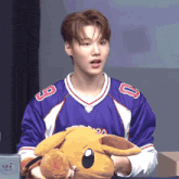 a man wearing a blue jersey with the number 8 on it