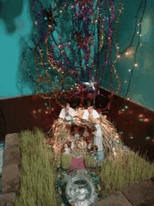 a christmas nativity scene with a tree and decorations
