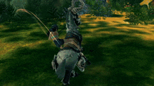 a woman is riding a horse with horns and a skull on its back