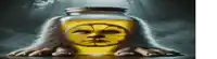 a jar with a face in it is being held by a person