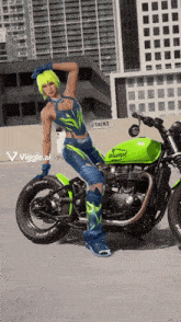 a woman is standing next to a green motorcycle with the word triumph on it
