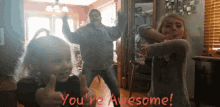 two little girls are giving a thumbs up with the words you 're awesome